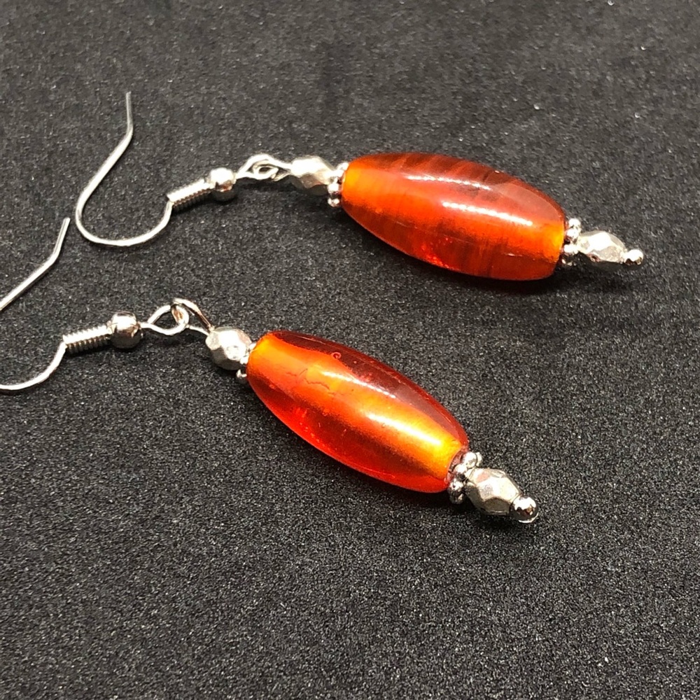 Linear orange glass bead dangle earrings